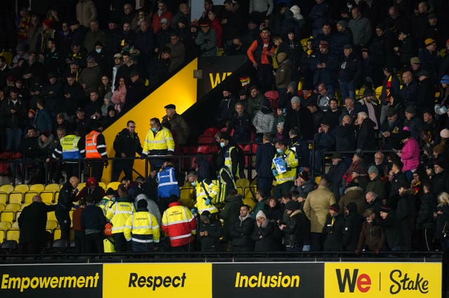 Medical staff attend to an emergency in the stands in the match between Watford and Chelsea