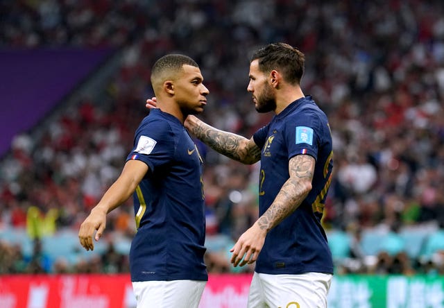 Theo Hernandez (right) celebrates with team-mate Kylian Mbappe