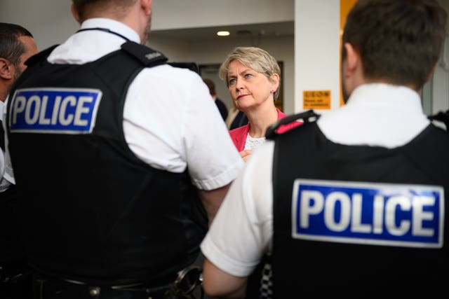 Home Secretary Yvette Cooper speaks to police officers (Leon Neal/PA)