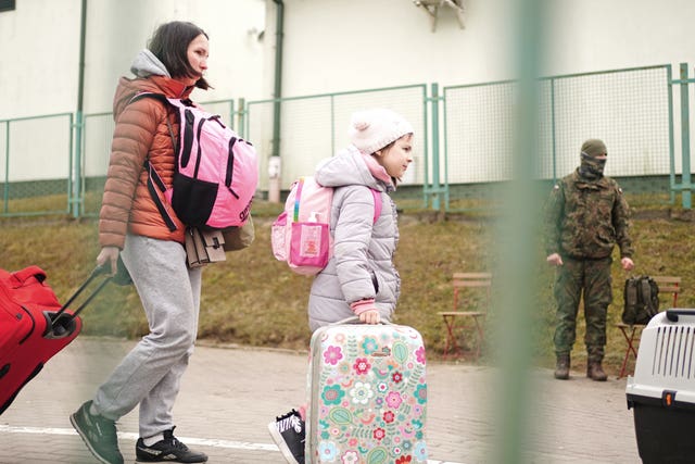 A family crossing the border point from Ukraine into Medyka, Poland