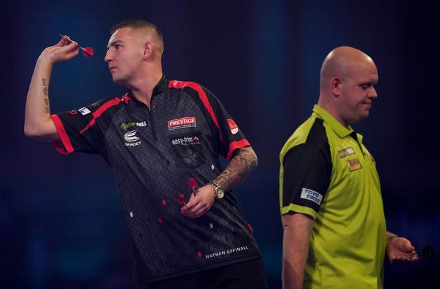 Nathan Aspinall (left) was unable to take his chance against a subdued Van Gerwen