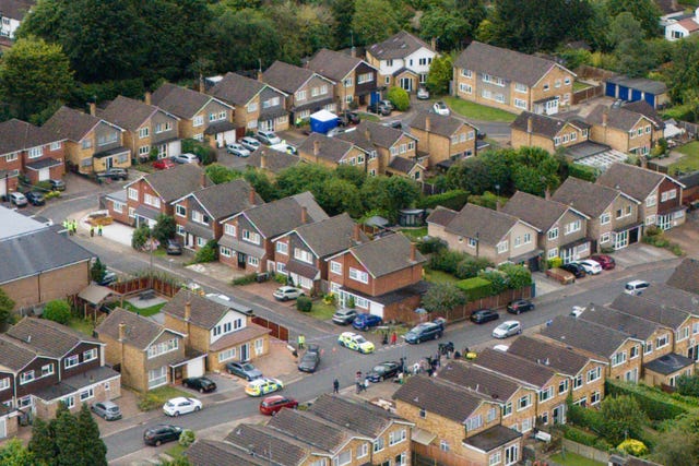 A view of the scene in Ashlyn Close, Bushey, Hertfordshire, where the wife and two daughters of BBC sports commentator John Hunt were killed