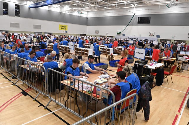 Election workers counting ballots at the South Lake Leisure Centre in Craigavon, Co Armagh
