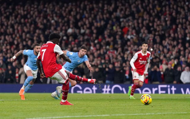 Bukayo Saka scores for Arsenal from the penalty spot 