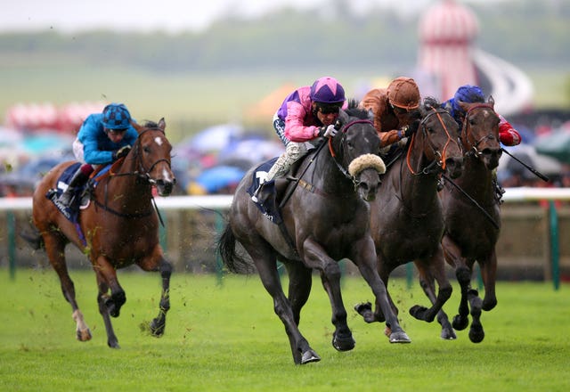 Azure Blue (third right, pink sleeves) winning at Newmarket