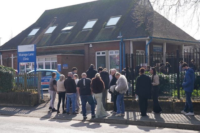 People queuing to receive vaccines and antibiotics at Vicarage Lane Clinic, Ashford, Kent