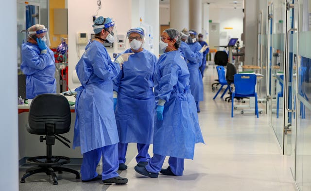 Health workers wearing full personal protective equipment