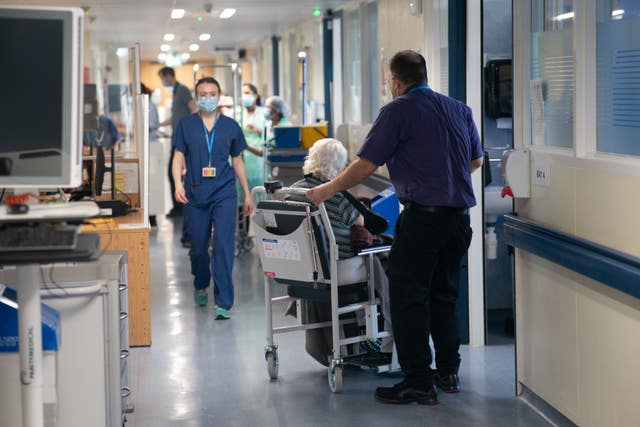 Hospital staff and patients in a hospital ward