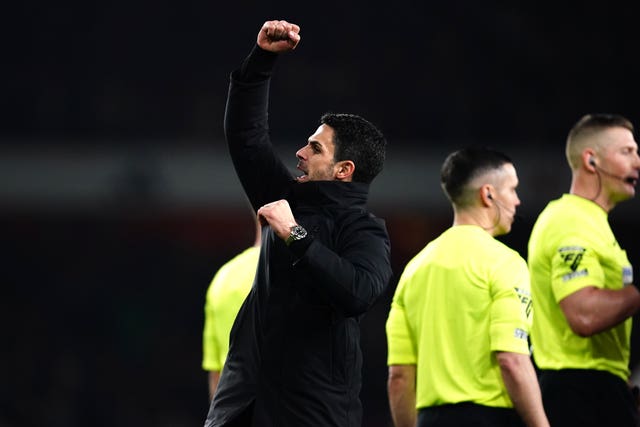 Manager Mikel Arteta, left, celebrates victory with the Arsenal fans