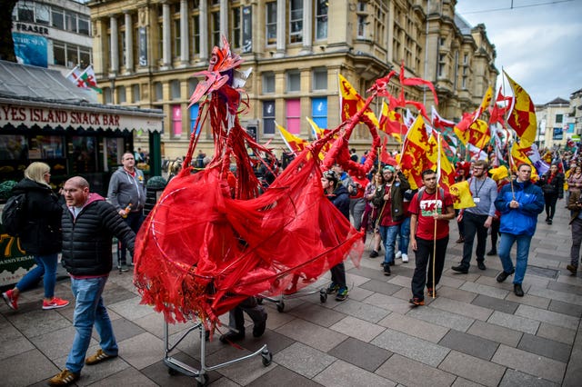 A Welsh red dragon is pulled along during a St David’s Day Parade in Cardiff