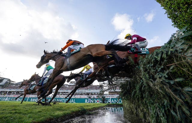 Noble Yeats, a 50-1 outsider ridden by Sam Waley-Cohen, at the waterjump on their way to victory in the Grand National at Aintree