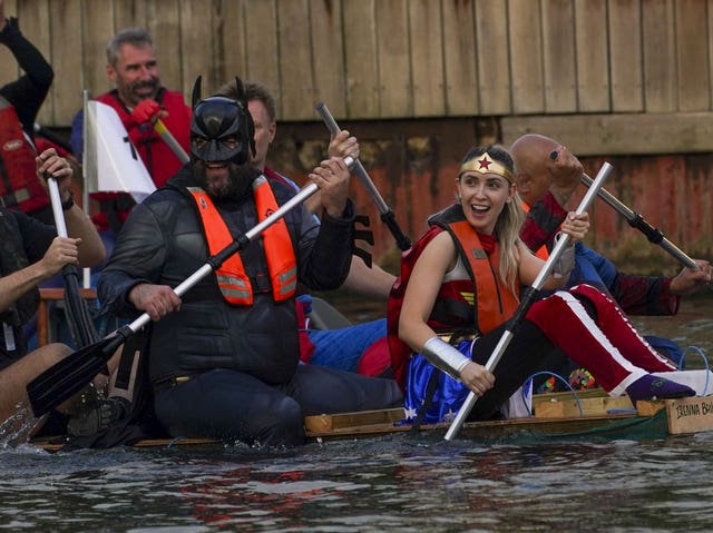 Rowers dressed as Batman and Wonder Woman