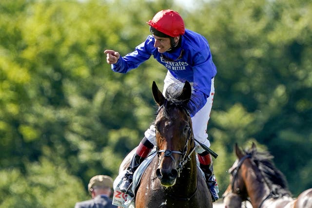 Adam Kirby celebrates aboard Adayar at Epsom