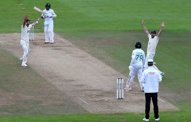 James Anderson (left) made Abid Ali his 599th Test wicket