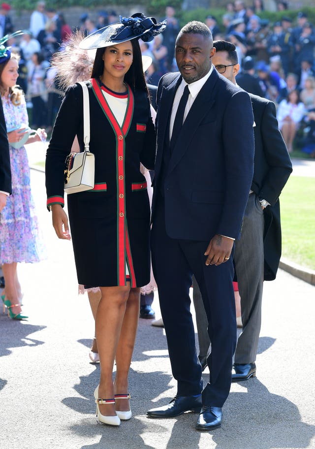 Idris Elba and Sabrina Dhowre arrive at St George’s Chapel (Ian West/PA)