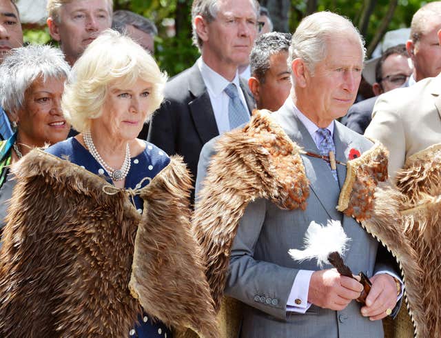 Charles and Camilla during their 2015 tour of New Zealand wearing korowai, cloaks made of kiwi feathers as they visit Kiingi Tuheitia. John Stillwell/PA Wire