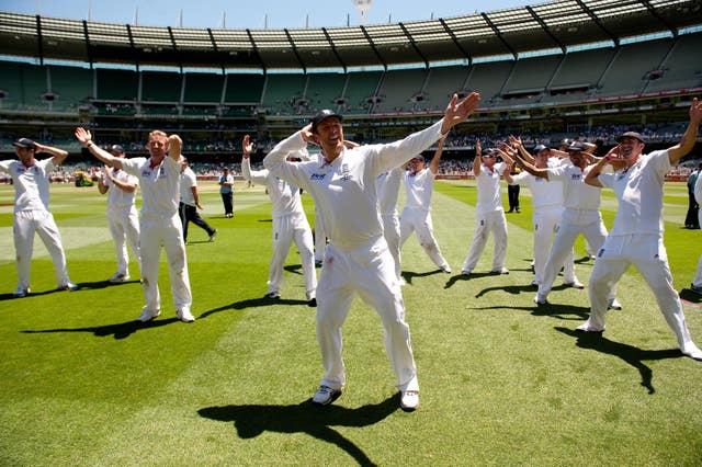 England's players celebrate by doing the sprinkler dance after victory at the MCG 