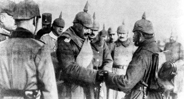 Kaiser Wilhelm II awarding decorations to soldiers.