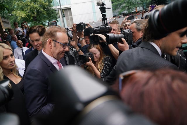 Spacey surrounded by media outside Southwark Crown Court