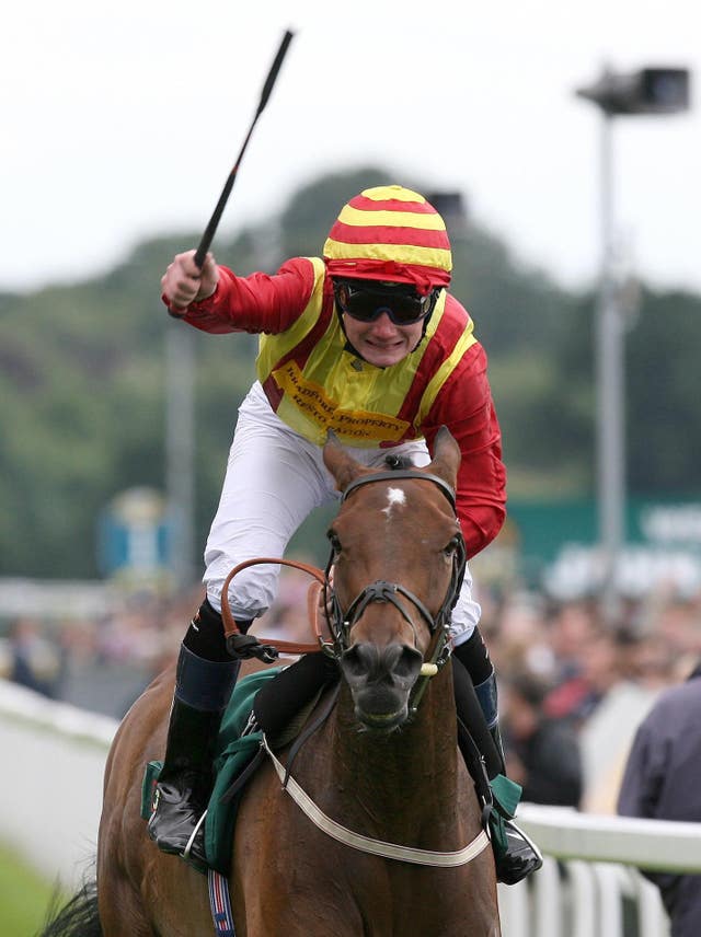 Freddy Tylicki salutes the crowd as Flying Clarets crosses the line 