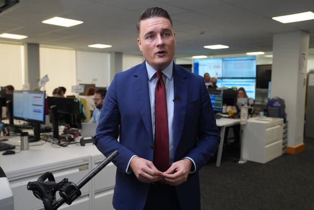 Wes Streeting speaking to camera in an office setting