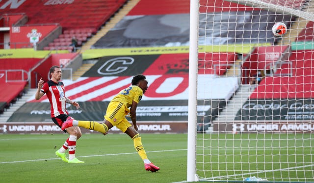 Joe Willock runs away to celebrate scoring 