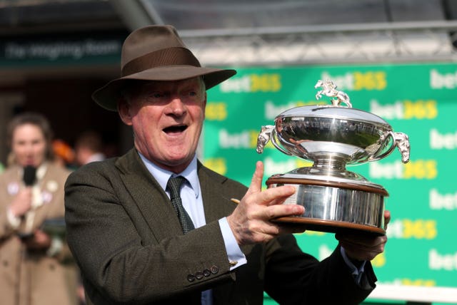 Willie Mullins lifts the trophy at Sandown 