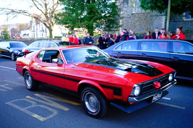 One of the cars in the funeral procession of Jack Lis as it arrives at St Martin’s Church, Caerphilly (Ben Birchall/PA)