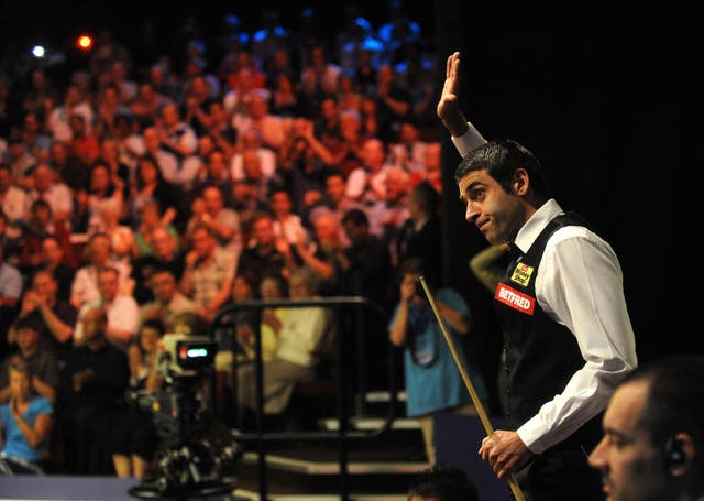 Ronnie O'Sullivan waves to the crowd at the Crucible