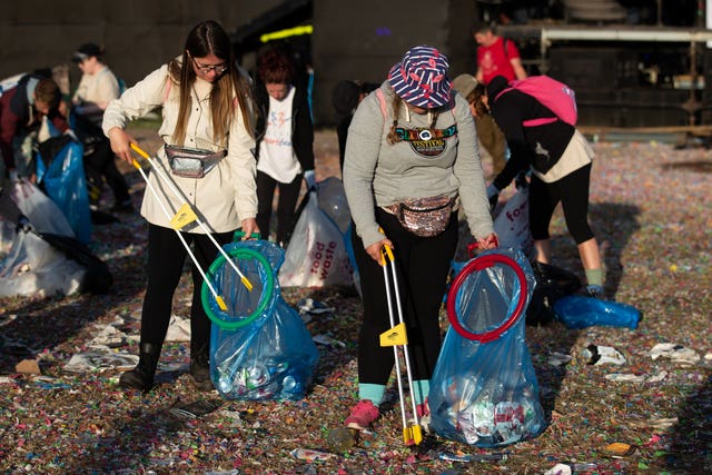 Clean-up begins in front of the Pyramid Stage 