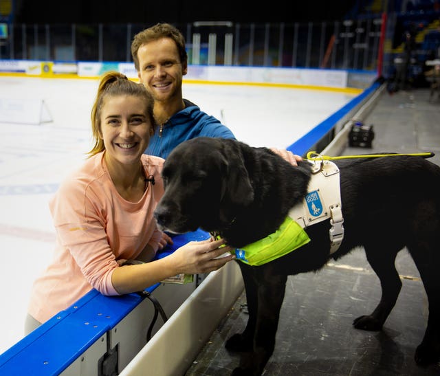 Libby Clegg with her guide dog, Hatti, and Mark Hanretty