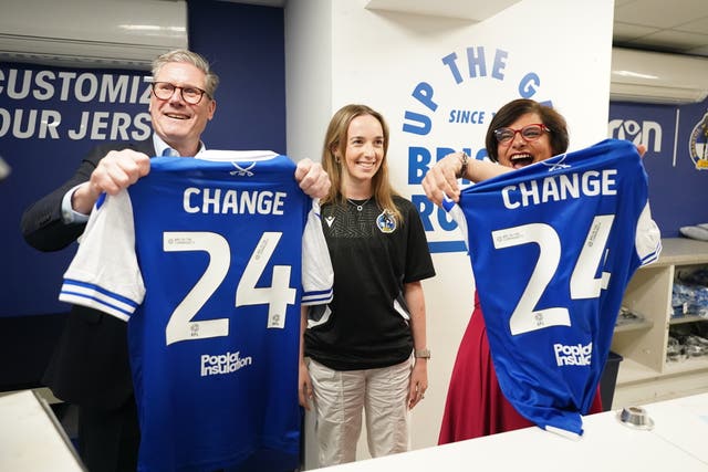 Labour Party leader Sir Keir Starmer with Thangam Debbonaire (right) after printing football shirts during a visit to Bristol Rovers FC while on the General Election campaign trail