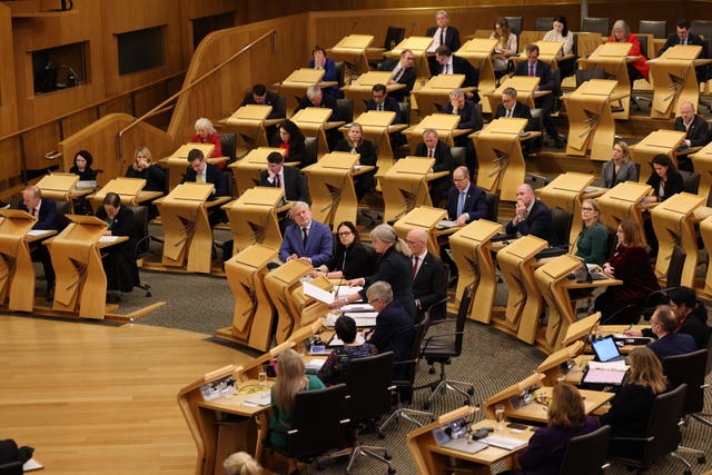 Holyrood chamber while Shona Robison stands to speak