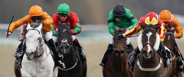 Rhys Clutterbuck riding Cappananty Con (left) wins The Betway Handicap at Lingfield Park Racecourse