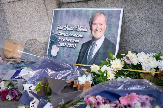 Flowers for Sir David Amess outside the Houses of Parliament, in Westminster, London