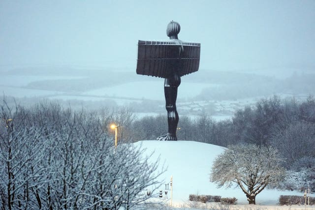 Snow surrounds the Angel of the North in Gateshead 