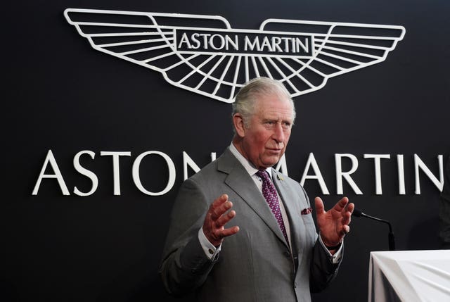 The prince makes a during a visit to the Aston Martin Lagonda factory (Rebecca Naden/PA).