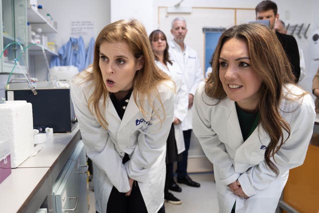 Princess Beatrice with television presenter, meteorologist and new Borne Ambassador, Laura Tobin (right), during a visit to the Borne research laboratories at Chelsea and Westminster Hospital in London (Stefan Rousseau/PA)