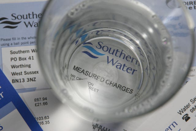 A glass of water placed on top of a Southern Water utility bill