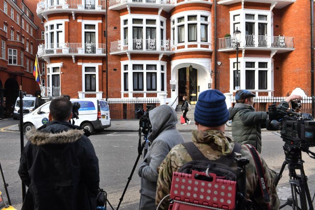 Media gather outside the Ecuadorian Embassy 