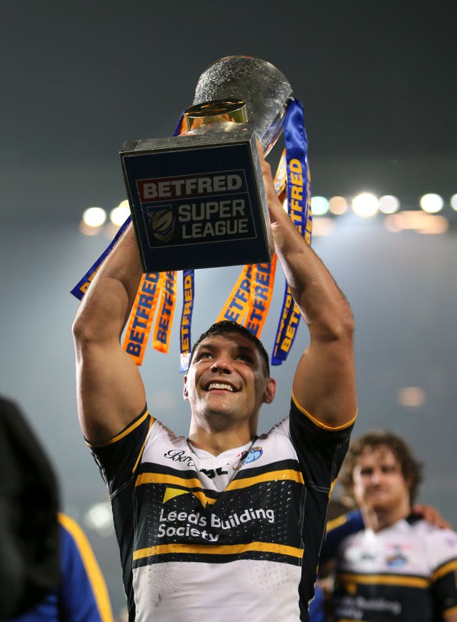 Ryan Hall lifts the Super League trophy after a Leeds Grand Final success