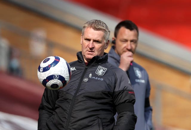 Aston Villa manager Dean Smith, left, took encouragement from the defeat to Liverpool