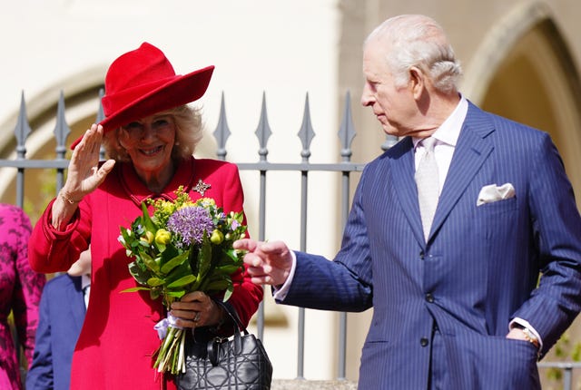 Camilla in a bright dress and hat with Charles at an Easter service