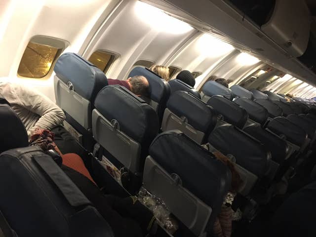 The scene inside a plane from Kiev after it landed at Birmingham having been diverted from Gatwick