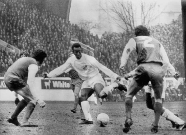Pele, playing for club side Santos, takes on Sheffield Wednesday defenders during a friendly at Hillsborough in February 1972. Despite being played on a Wednesday afternoon because of the miners' strike, a capacity-crowd turned out to watch the Brazilian team win 2-0