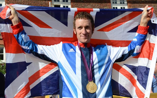 Sir Bradley Wiggins celebrates his London 2012 Olympic road time-trial gold medal