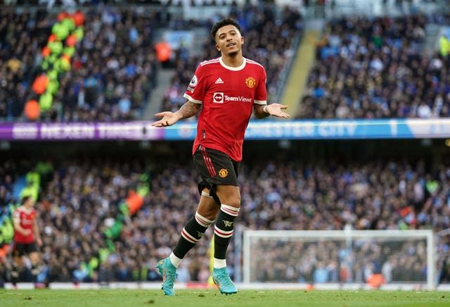 Jadon Sancho celebrates scoring in the Manchester derby 