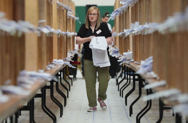 Count staff sort ballots at Nemo Rangers GAA club in Cork during a count for European elections