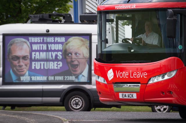 A poster with the faces of Nigel Farage and Boris Johnson, and a red Vote Leave bus 