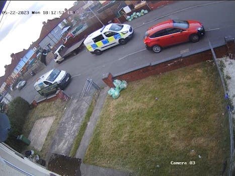 Screen shot taken from CCTV dated 22/05/23 appearing to show a police van on Howell Road at it was following two teenagers on a bike in Ely, Cardiff, minutes before they crashed and died, sparking a police riot that lasted several hours